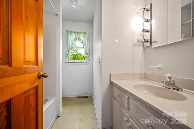 49 Meadowbrook Rd, Rutherfordton, NC 28139 - bathroom featuring vanity, tile patterned floors, and a textured ceiling