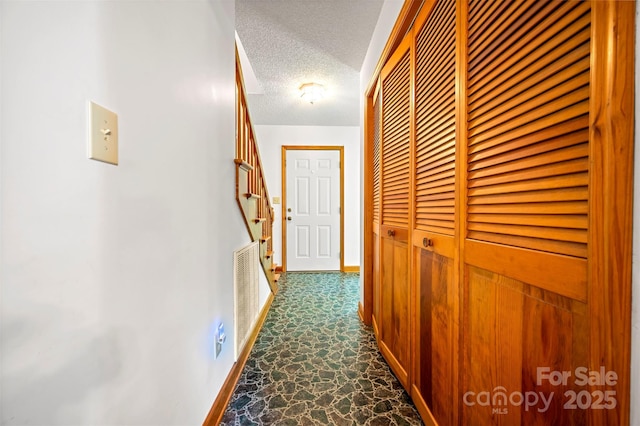 49 Meadowbrook Rd, Rutherfordton, NC 28139 - corridor with stairway and a textured ceiling