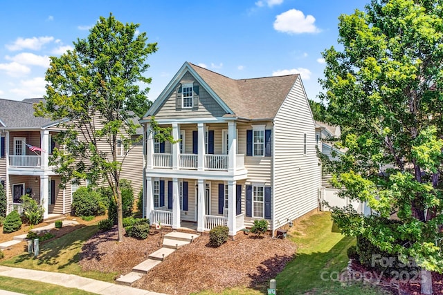 10509 Serape Rd, Charlotte, NC 28277 - greek revival inspired property with a porch, roof with shingles, a front yard, and a balcony