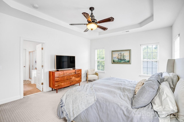 10509 Serape Rd, Charlotte, NC 28277 - bedroom featuring a raised ceiling, carpet floors, ceiling fan, and connected bathroom