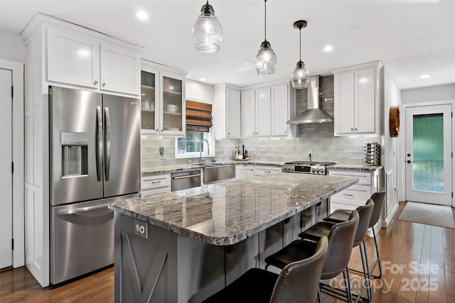 1181 Forest Lake Heights Dr, Nebo, NC 28761 - kitchen featuring stainless steel appliances, wall chimney exhaust hood, dark wood-type flooring, decorative backsplash, and white cabinetry