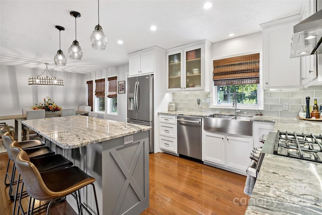1181 Forest Lake Heights Dr, Nebo, NC 28761 - kitchen with stainless steel appliances, range hood, decorative backsplash, recessed lighting, and a kitchen island