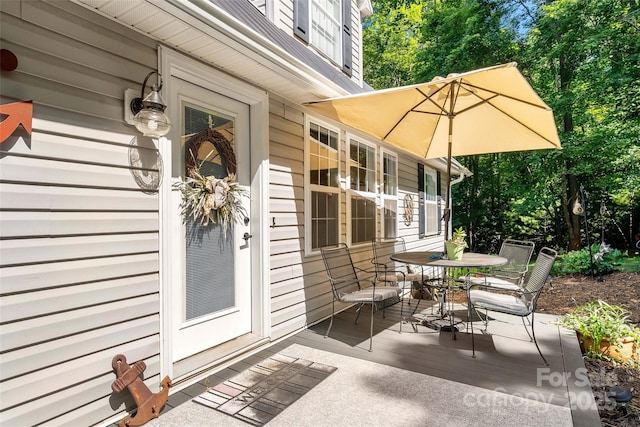 1181 Forest Lake Heights Dr, Nebo, NC 28761 - view of patio / terrace featuring outdoor dining area and view of wooded area