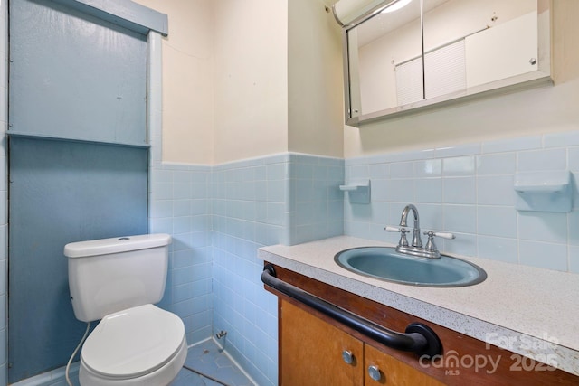 100 Nimitz Dr, Brevard, NC 28712 - bathroom featuring vanity, tile walls, and wainscoting