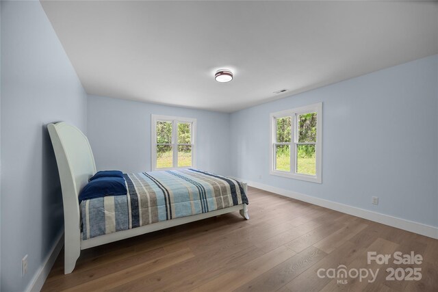 221 John C Logan Rd, Rutherfordton, NC 28139 - bedroom with baseboards and wood finished floors