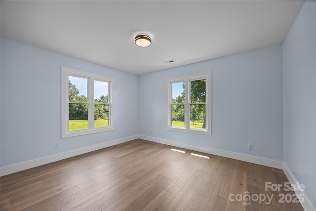 221 John C Logan Rd, Rutherfordton, NC 28139 - unfurnished room with baseboards and hardwood / wood-style floors