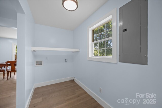 221 John C Logan Rd, Rutherfordton, NC 28139 - laundry room featuring electric panel, hookup for a washing machine, wood finished floors, and hookup for a gas dryer