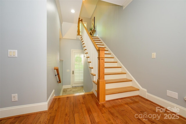 6312 Mission Pl, Charlotte, NC 28210 - stairs with wood finished floors and recessed lighting