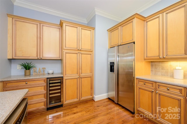6312 Mission Pl, Charlotte, NC 28210 - kitchen featuring wine cooler, appliances with stainless steel finishes, light wood-type flooring, backsplash, and light stone counters