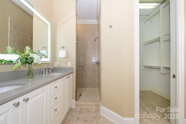 6312 Mission Pl, Charlotte, NC 28210 - bathroom featuring a stall shower, double vanity, tile patterned floors, and crown molding