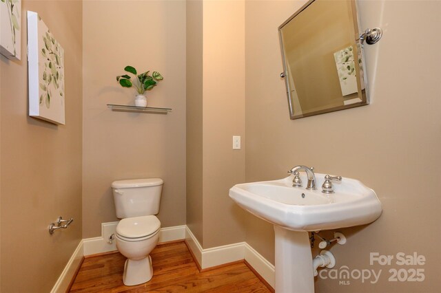 6312 Mission Pl, Charlotte, NC 28210 - bathroom with toilet and wood finished floors