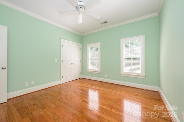 6312 Mission Pl, Charlotte, NC 28210 - unfurnished bedroom featuring light wood-type flooring, ornamental molding, ceiling fan, and a closet