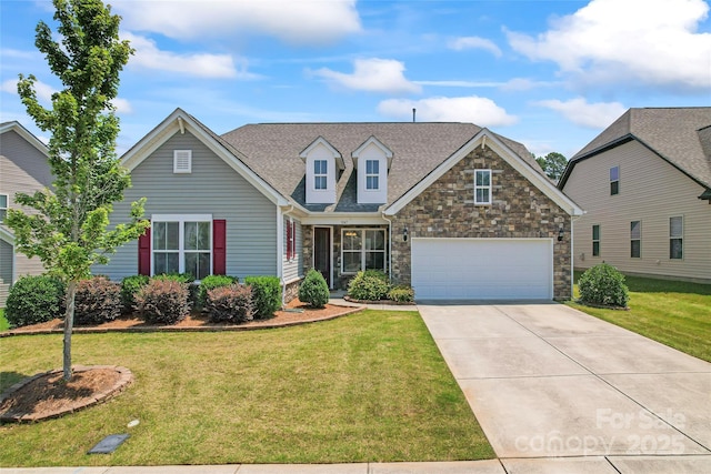 9547 Horsebit Ln, Concord, NC 28027 - view of front facade with driveway, stone siding, a front yard, a garage, and a shingled roof