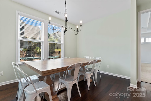 9547 Horsebit Ln, Concord, NC 28027 - dining room with dark wood-type flooring and a chandelier