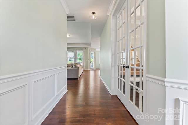 9547 Horsebit Ln, Concord, NC 28027 - corridor featuring french doors, dark wood finished floors, and a wainscoted wall