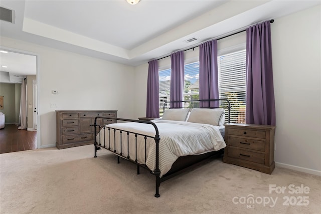 9547 Horsebit Ln, Concord, NC 28027 - bedroom featuring light carpet and a tray ceiling