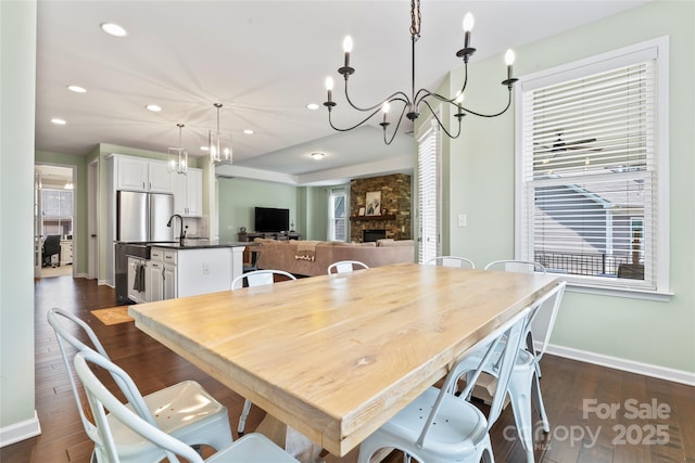9547 Horsebit Ln, Concord, NC 28027 - dining area featuring dark wood-style flooring, healthy amount of natural light, a chandelier, and recessed lighting