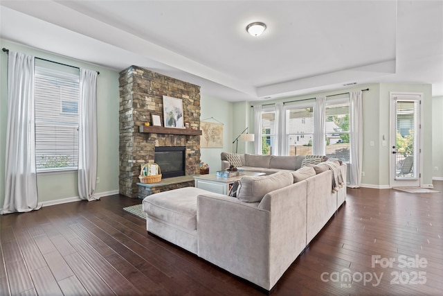 9547 Horsebit Ln, Concord, NC 28027 - living area featuring dark wood-style flooring, a fireplace, and a raised ceiling