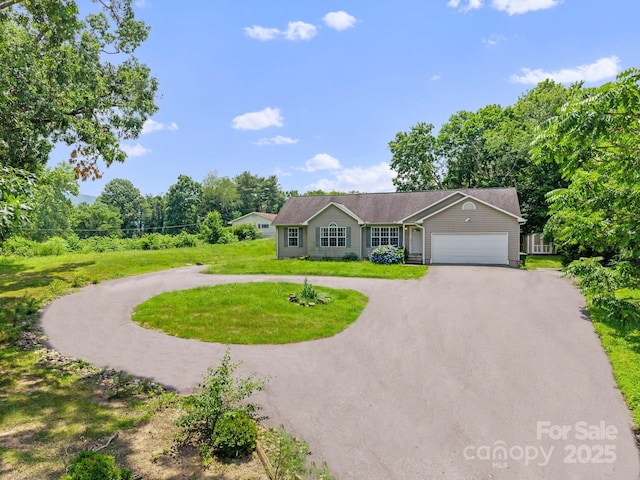 55 Wyatt St, Asheville, NC 28803 - ranch-style home featuring curved driveway, a garage, and a front lawn