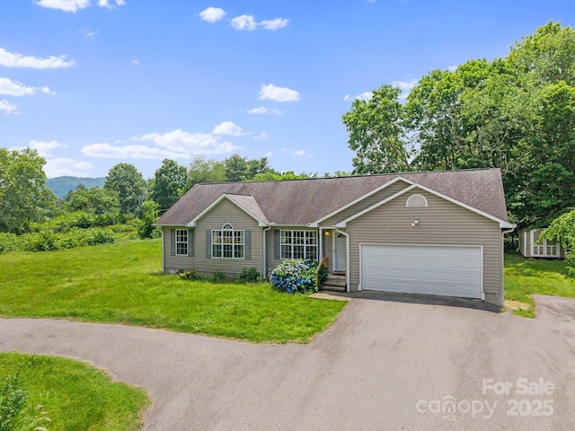 55 Wyatt St, Asheville, NC 28803 - single story home with asphalt driveway, a garage, and a front lawn