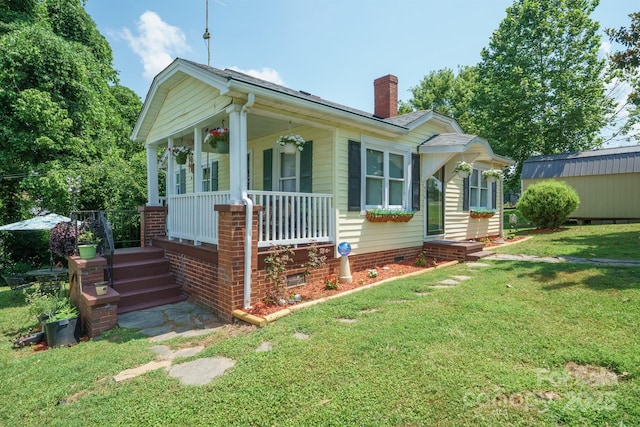576 Washington Ave NW, Valdese, NC 28690 - bungalow featuring a porch, a chimney, and a front lawn