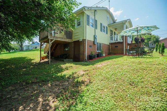576 Washington Ave NW, Valdese, NC 28690 - back of house with stairs, a deck, a yard, and brick siding
