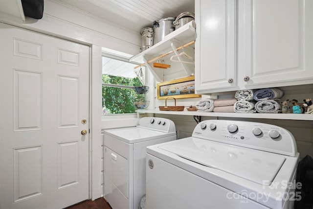576 Washington Ave NW, Valdese, NC 28690 - washroom featuring cabinet space and washing machine and clothes dryer