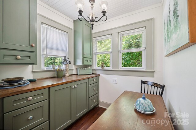576 Washington Ave NW, Valdese, NC 28690 - dining room featuring a chandelier and dark wood finished floors