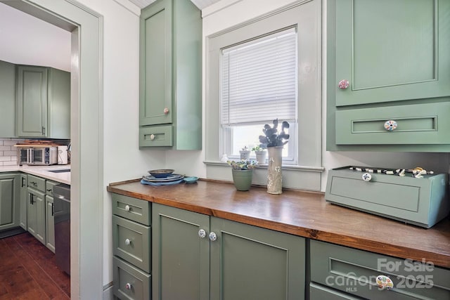 576 Washington Ave NW, Valdese, NC 28690 - kitchen with green cabinets, butcher block counters, dark wood-style floors, and tasteful backsplash