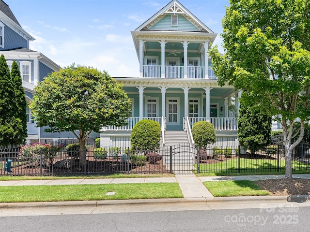 8918 Cotton Press Rd, Charlotte, NC 28277 - view of front of home with covered porch, a balcony, a fenced front yard, and a gate
