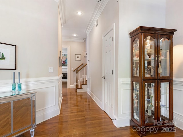 8918 Cotton Press Rd, Charlotte, NC 28277 - hall with wood finished floors, crown molding, a decorative wall, a wainscoted wall, and recessed lighting