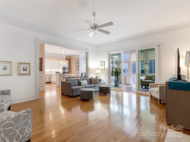 8918 Cotton Press Rd, Charlotte, NC 28277 - living area featuring a ceiling fan, crown molding, and light wood-type flooring