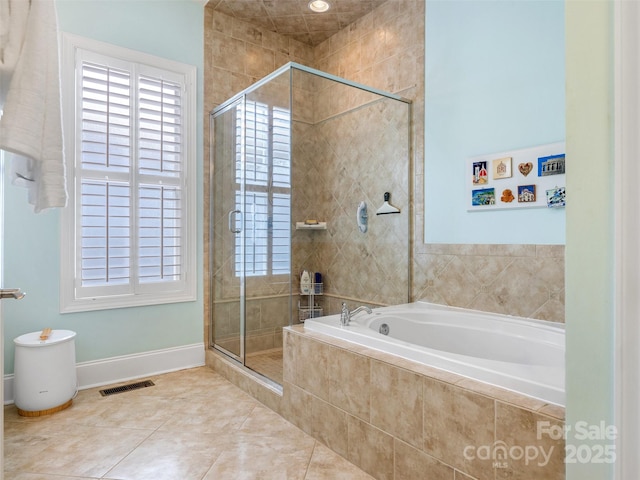 8918 Cotton Press Rd, Charlotte, NC 28277 - full bath featuring a garden tub, a stall shower, healthy amount of natural light, and tile patterned flooring