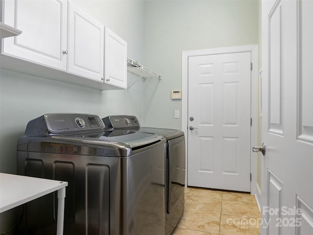 8918 Cotton Press Rd, Charlotte, NC 28277 - laundry room featuring cabinet space, washer and clothes dryer, and light tile patterned floors
