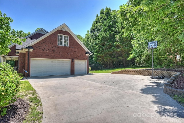 6309 Chamar Cir, Kannapolis, NC 28081 - view of home's exterior featuring concrete driveway, brick siding, and an attached garage
