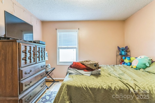 1713 Poe Cir, Hickory, NC 28601 - bedroom featuring wood finished floors and a textured ceiling