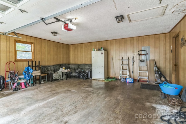 1713 Poe Cir, Hickory, NC 28601 - garage with wood walls and a garage door opener