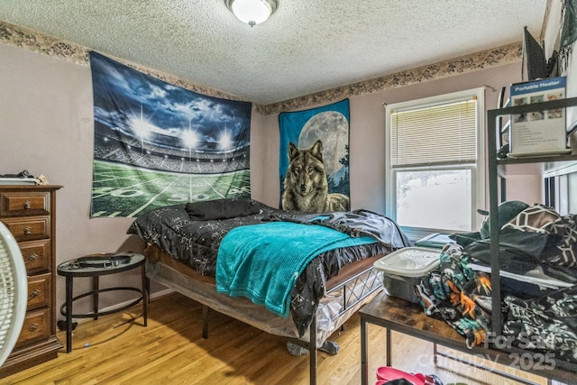 1713 Poe Cir, Hickory, NC 28601 - bedroom with a textured ceiling and wood finished floors
