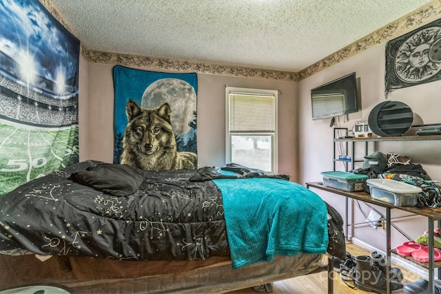 1713 Poe Cir, Hickory, NC 28601 - bedroom with a textured ceiling and wood finished floors