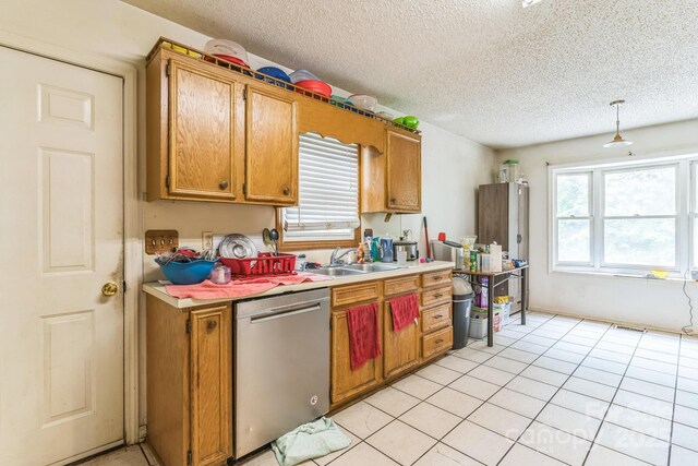 1713 Poe Cir, Hickory, NC 28601 - kitchen with dishwasher, light countertops, a textured ceiling, plenty of natural light, and light tile patterned flooring