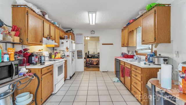 1713 Poe Cir, Hickory, NC 28601 - kitchen with white appliances, under cabinet range hood, light countertops, light tile patterned floors, and a textured ceiling