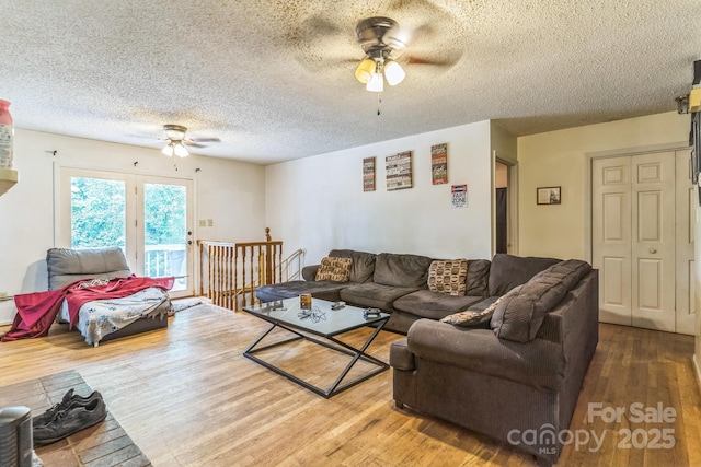 1713 Poe Cir, Hickory, NC 28601 - living area featuring a ceiling fan, wood finished floors, and a textured ceiling