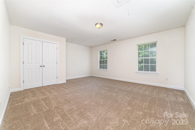 5233 Halverson Ct, Kannapolis, NC 28083 - unfurnished bedroom featuring carpet, attic access, and a closet