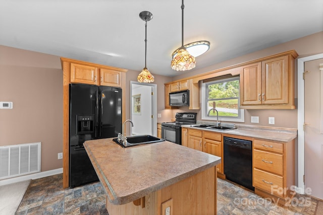 435 Pauline Ave, Franklin, NC 28734 - kitchen featuring black appliances, light countertops, an island with sink, light brown cabinets, and stone finish floors