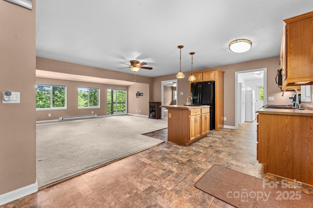 435 Pauline Ave, Franklin, NC 28734 - kitchen featuring a baseboard radiator, open floor plan, carpet, black refrigerator with ice dispenser, and a ceiling fan
