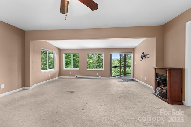 435 Pauline Ave, Franklin, NC 28734 - unfurnished living room featuring a baseboard heating unit, a ceiling fan, and carpet floors