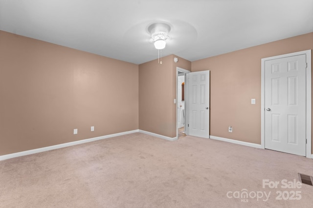 435 Pauline Ave, Franklin, NC 28734 - unfurnished bedroom featuring light carpet and ceiling fan