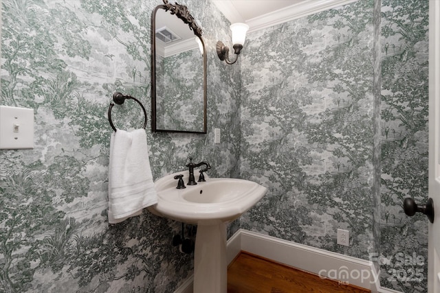 3408 Sandalwood Ln, Waxhaw, NC 28173 - bathroom with wallpapered walls, ornamental molding, and wood finished floors