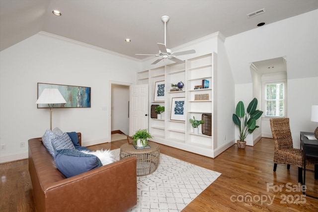 3408 Sandalwood Ln, Waxhaw, NC 28173 - living area featuring ceiling fan, built in shelves, wood finished floors, ornamental molding, and recessed lighting