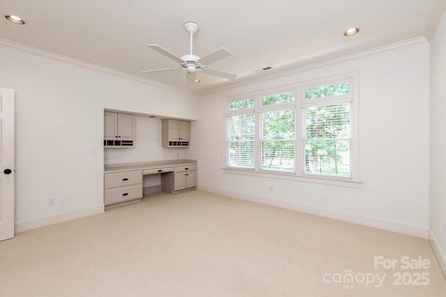 3408 Sandalwood Ln, Waxhaw, NC 28173 - unfurnished office with light carpet, built in desk, crown molding, ceiling fan, and recessed lighting